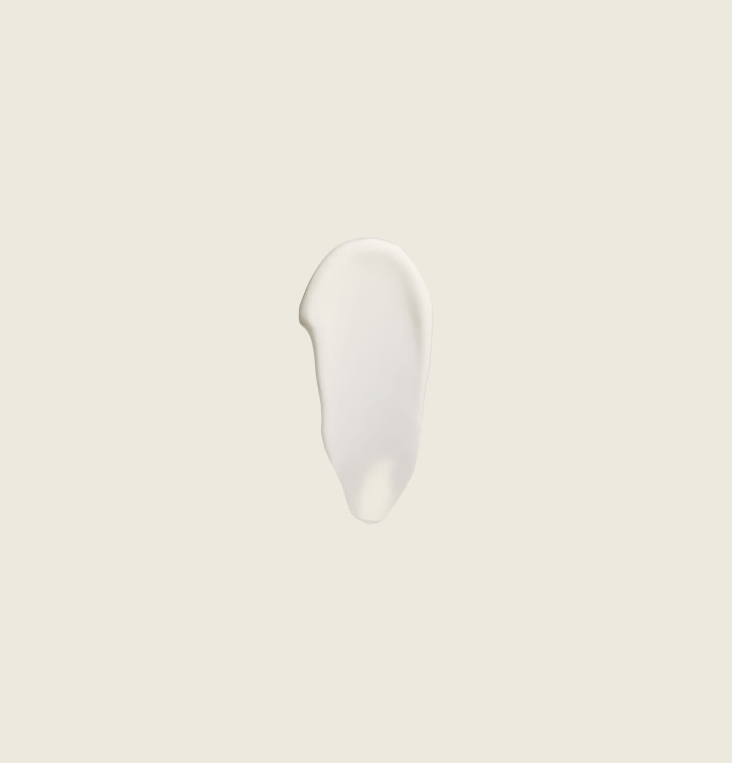 Un pot ouvert du Masque de Nuit Récupérateur Sublime révèle un gel-crème jaune pâle.