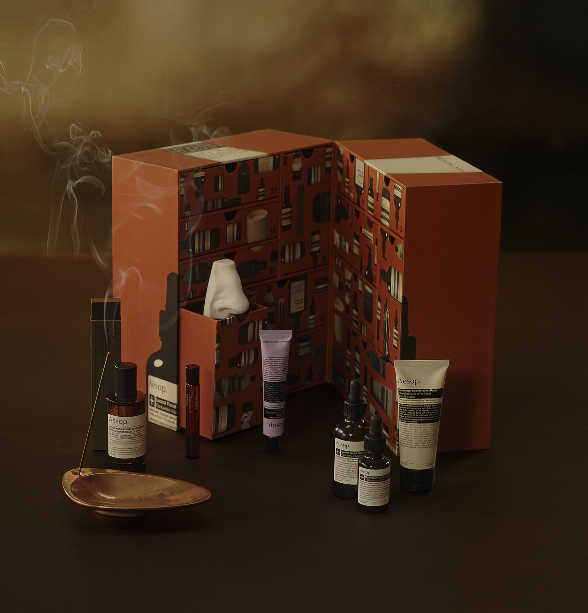 The Aesop Abode advent calendar unwrapped and opened to display the products within it.
