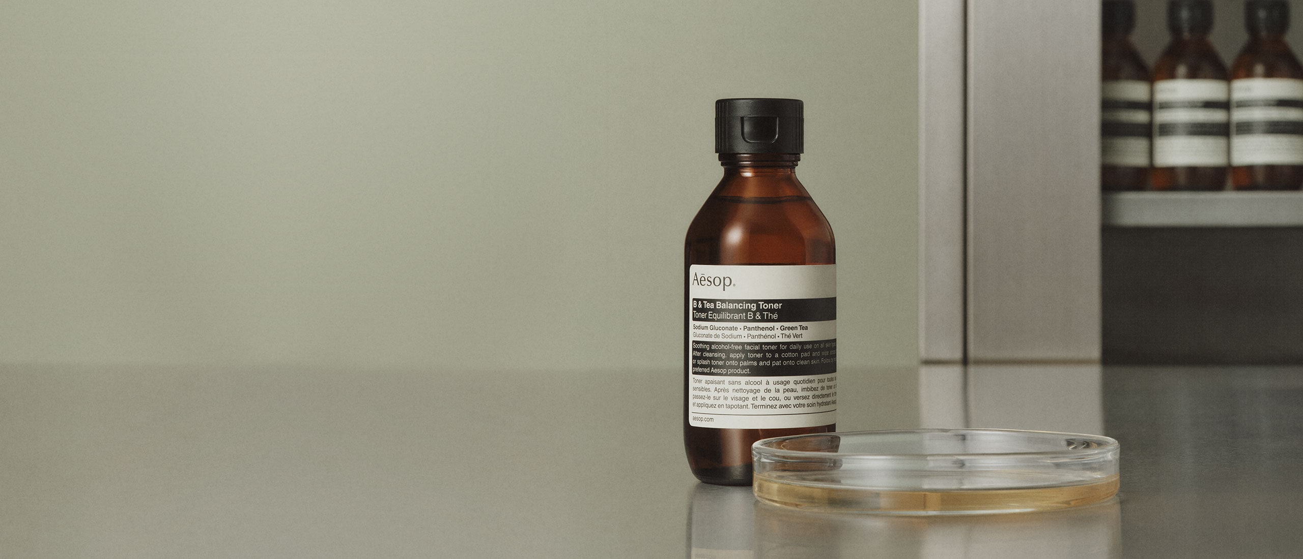 B & Tea Balancing Toner bottle placed next to a petri dish