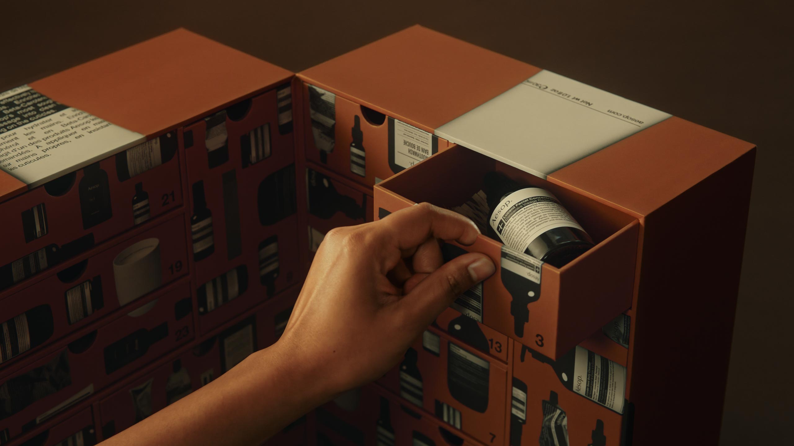 Opening the draw of The Aesop Abode advent calendar revealing Lucent Facial Concentrate.