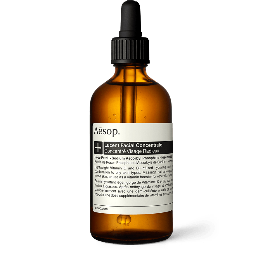 Lucent Facial Concentrate in an amber glass bottle with a pipette. 